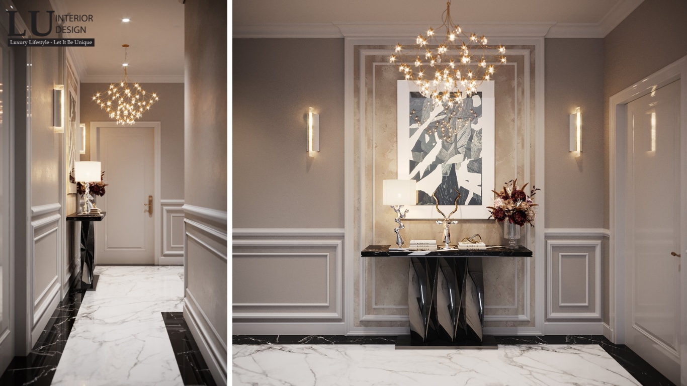 Sảnh biệt thự Tân Phú với bàn console, đèn chùm và tranh trang trí phong cách Modern Classic.